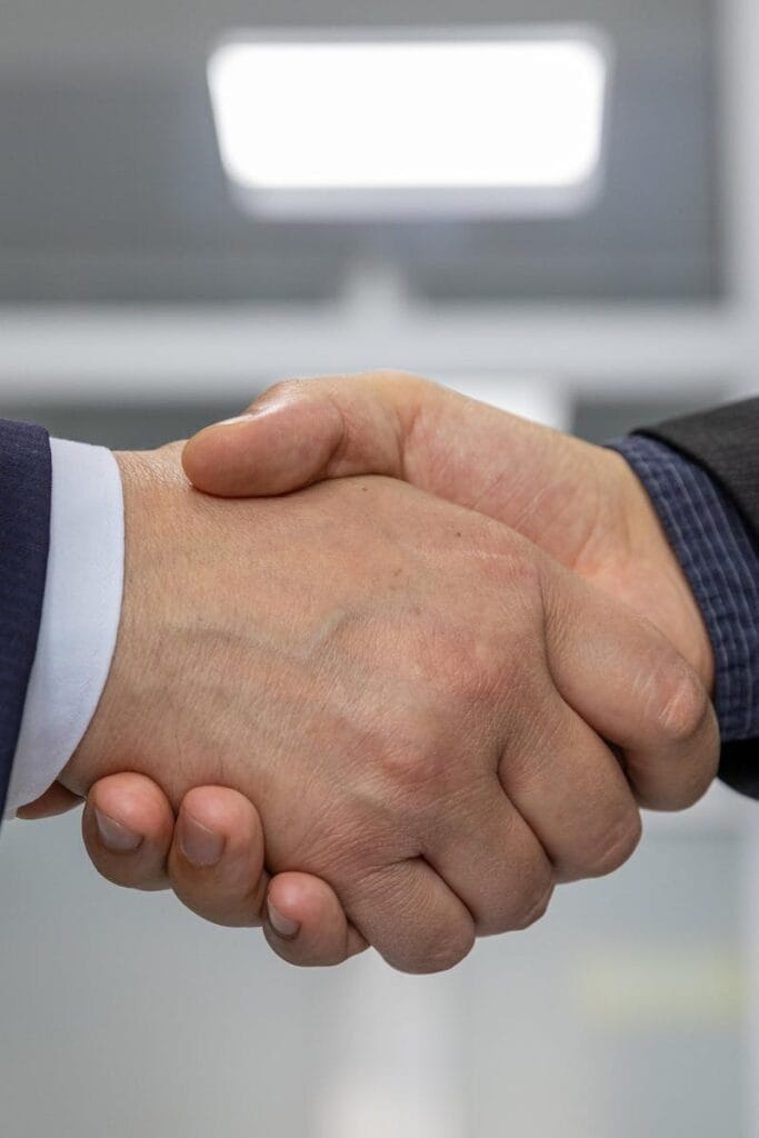 Close-up of a business handshake representing a successful partnership or agreement.